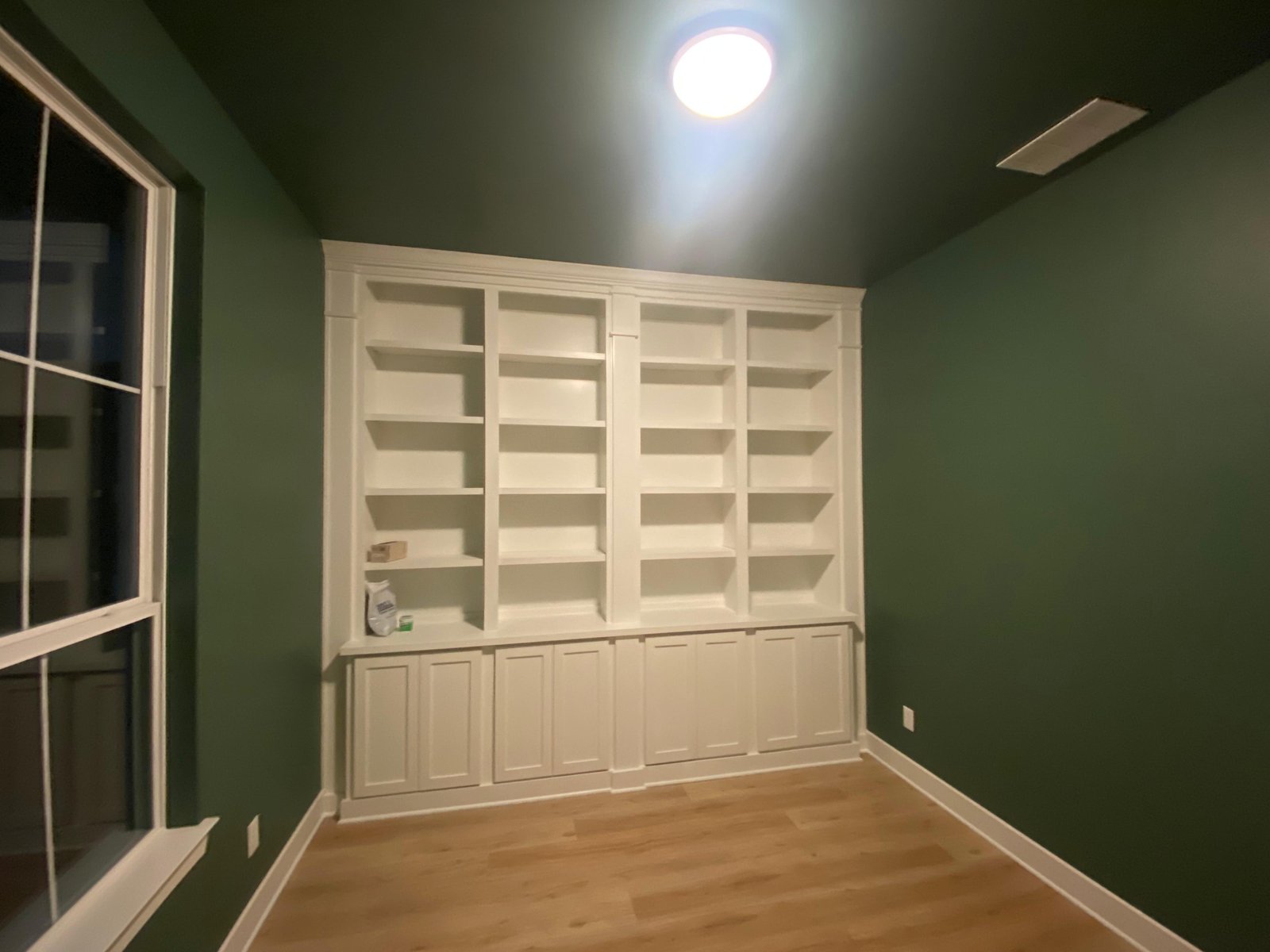 Custom builtin bookshelves in green room